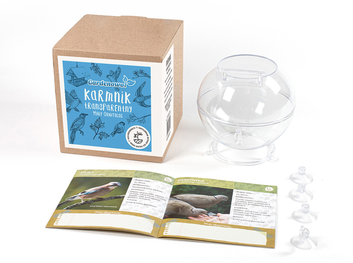 transparentny karmnik Gardenowo transparentny karmnik obok pudełko z książeczką i instrukcją